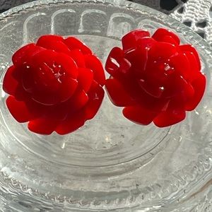 Vintage red Bakelite (?) flower clip earrings